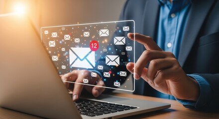 Photo of a businessman interacts with a digital interface displaying email icons and notifications on a laptop screen, symbolizing digital communication and online messaging