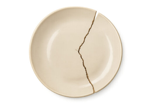 Broken white plate on transparent background representing divorce or separation