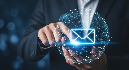 Photo of a persons hand interacts with a glowing digital network displaying an email icon, symbolizing global digital communication and connectivity