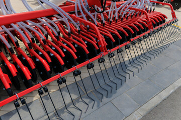 Agricultural machinery and parts of mechanisms on a sunny day. Texture, background for design. 