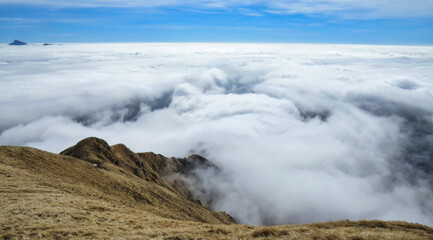 a magnificent sea of ​​clouds under the crest of the Parma Apennines