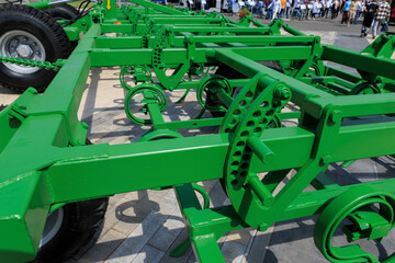 Agricultural machinery and parts of mechanisms on a sunny day. Texture, background for design. 