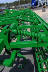 Agricultural machinery and parts of mechanisms on a sunny day. Texture, background for design. 