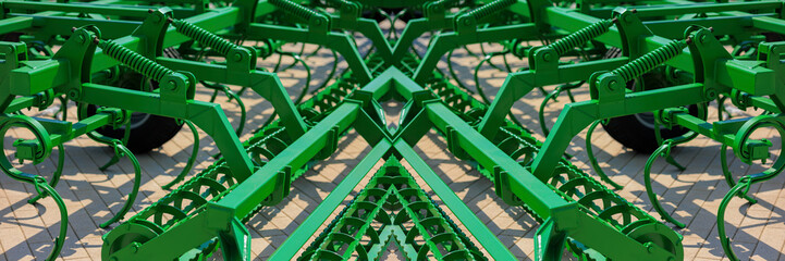 Agricultural machinery and parts of mechanisms on a sunny day. Texture, background for design. 