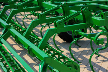Agricultural machinery and parts of mechanisms on a sunny day. Texture, background for design. 