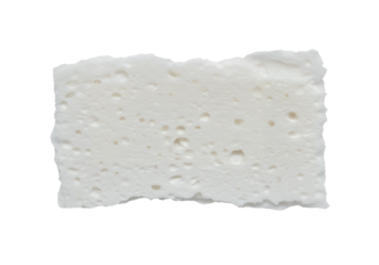 White porous material fragment irregular edges holefilled surface dark background