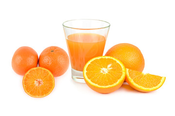 Oranges, tangerines and fruit juice in a glass isolated on white background.