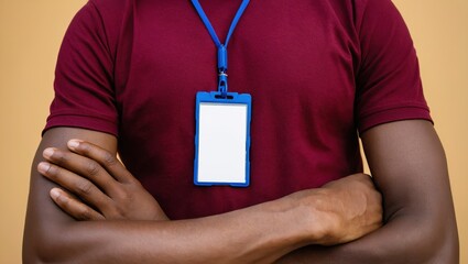 Man wearing blue badge holder and maroon shirt