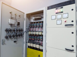 Industrial circuit breaker and  contactors on the main panel distribution, inspection and service concept with open the electrical panel.