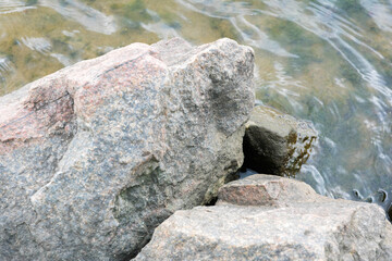 Textured River Stones in Flowing Water