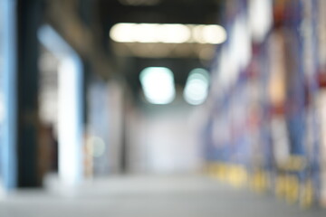 Blur Spacious warehouse interior with organized shelving units and bright lighting. Clean, efficient environment ideal for logistics, cargo storage, and distribution center workflow. for background.