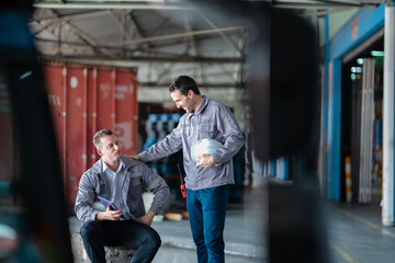 Warehouse professionals discussing shipment strategies via digital platform. Useful for content...