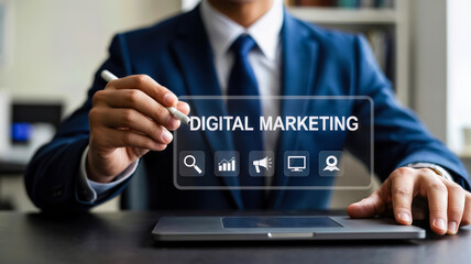 A businessman in a suit uses a stylus to interact with a digital marketing interface on a laptop