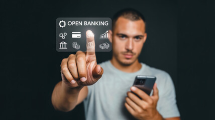 A man holding a smartphone points to a digital interface displaying open banking with financial icons, signifying the future of digital finance