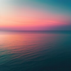 Obraz premium Serene sunset over calm ocean waters, displaying a gradient of pink, purple, and teal hues reflecting on the tranquil surface