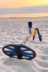 Metal detector, search on the beach in the sand, outdoor hobby