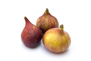 Three figs on a white background. Figs are high in fiber, which can help relieve constipation and promote a healthy digestive system.