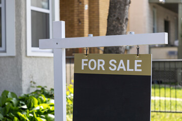 For sale sign near a house. Real estate market