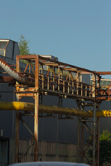 This is a building that features numerous pipes running extensively throughout its structure,...