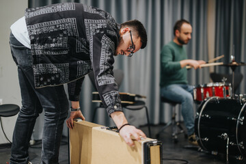 Musicians collaborating during a rehearsal session in a modern studio room