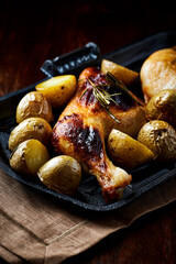 Crispy Baked Chicken Legs with potatoes.	