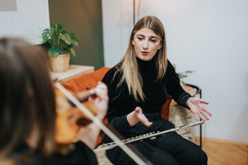 A musician appears to give instructions during a collaborative practice session with instruments...