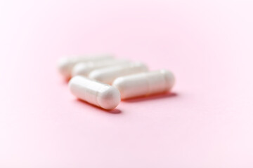Biotin capsules. Bright background. Soft focus. Close up. Copy space	