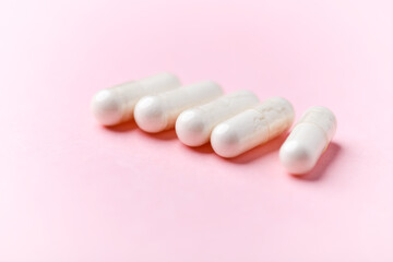 Biotin capsules. Bright background. Soft focus. Close up. Copy space	