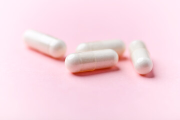 Biotin capsules. Bright background. Soft focus. Close up. Copy space	