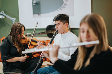 A group of talented young musicians play classical instruments including violin, flute, and...