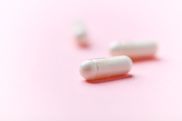 Biotin capsules. Bright background. Soft focus. Close up. Copy space	