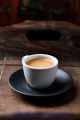 Cup of coffee on wooden background. Soft focus. Copy space	