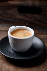 Cup of coffee on wooden background. Soft focus. Copy space	