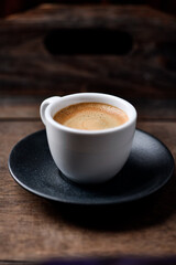 Cup of coffee on wooden background. Soft focus. Copy space	