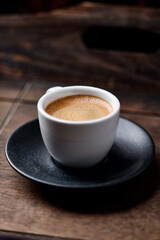 Cup of coffee on wooden background. Soft focus. Copy space	