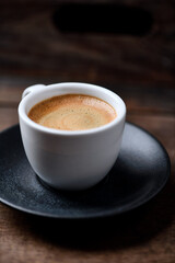 Cup of coffee on wooden background. Soft focus. Copy space	
