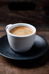 Cup of coffee on wooden background. Soft focus. Copy space	