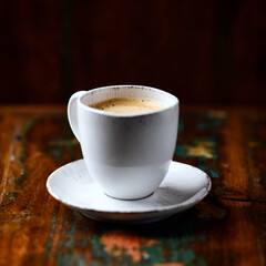 Cup of coffee on wooden background. Soft focus. Copy space	