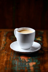 Cup of coffee on wooden background. Soft focus. Copy space	
