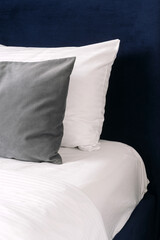 Stylish hotel room with a neatly made bed and modern bedding details