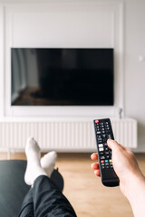Relaxing in a modern living room with a smart TV and cozy furniture setup