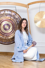 Woman in Meditation with Gong for Sound Healing