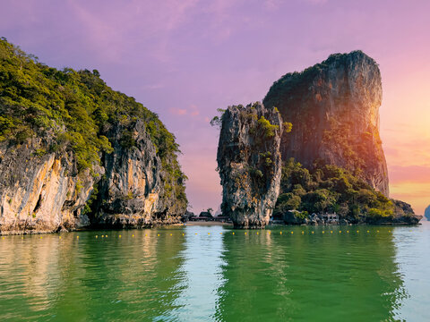 Landmark landscape ice cream cliffs and emerald waters at sunset in phang nga bay, Thailand - Powered by Adobe