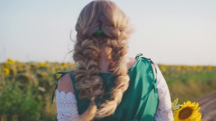 happy young beautiful blonde woman holds sunflower yellow flower in hands walking along dirt country road. summer blooming field sunflowers. joyful girl princess dress vintage style back rear view - Powered by Adobe