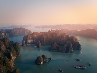 Breathtaking aerial view of Halong bay's majestic islands and tranquil waters at sunset in Vietnam © Parilov