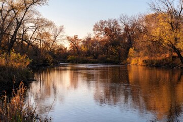 Fototapeta premium Autumn river scene at sunset