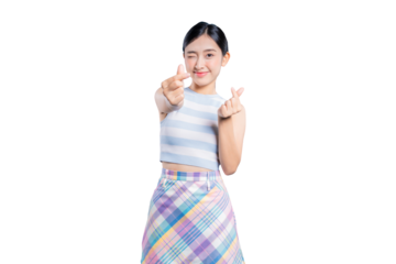 A playful young Asian woman winking and making trendy Korean mini heart gestures with both hands for the camera.
on png 