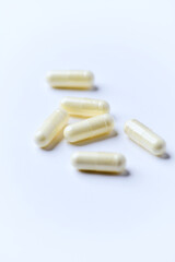 Alpha-lipoic acid capsules. Paper background. Soft focus. Close up. Copy space.	
