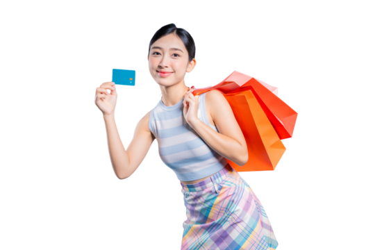 A confident young Asian woman with shopping bags, smiling and showing her credit card as a recommended payment method.on png
