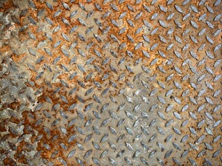 rusty metal texture. Rusty diamond steel plate texture, commonly used for industrial flooring,...